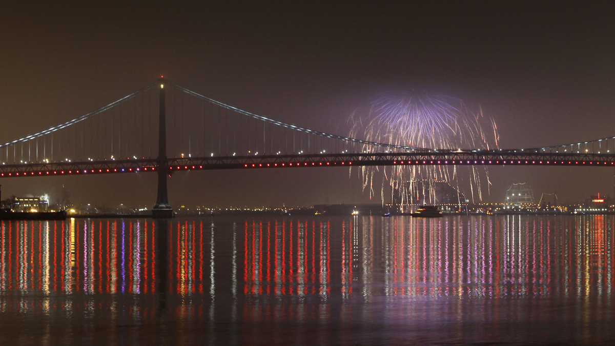  File photo: Fireworks explode in the foggy night sky above the Benjamin Franklin Bridge during a New Years celebration (Matt Slocum/AP Photo, file) 