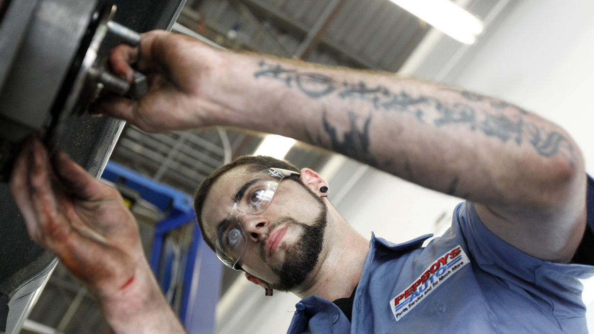  A technician works on a car at a Pep Boys Auto retail and service location, in Philadelphia. (Matt Rourke/AP Photo, file) 