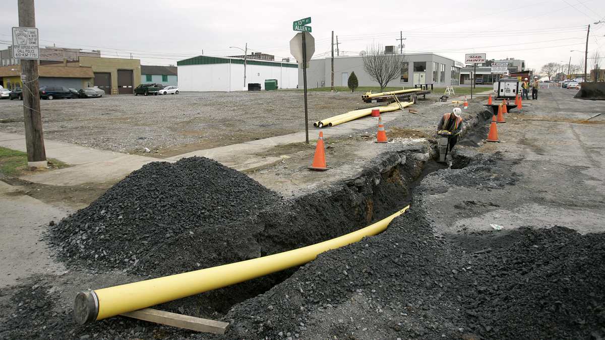  A crew member from tamps backfill over a new natural gas main that was replaced at the intersection of 13th and Allen Street in Allentown Pa. Monday, April 4, 2011. The main is replacing the original that leaked causing the gas explosion that killed five people in Allentown on Feb. 9. (Rich Schultz/AP Photo, file) 