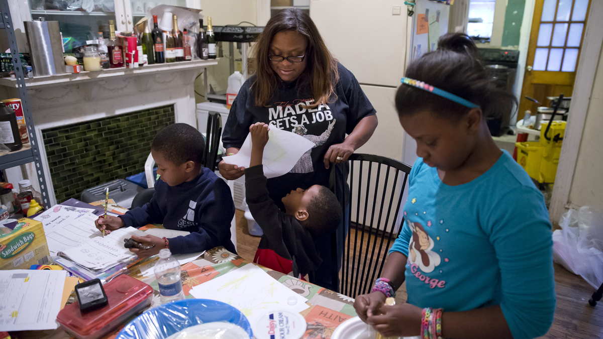 This AP file photo shows a Philadelphia family who receives money from the Supplemental Nutrition Assistance Program (Matt Rourke/AP Photo)