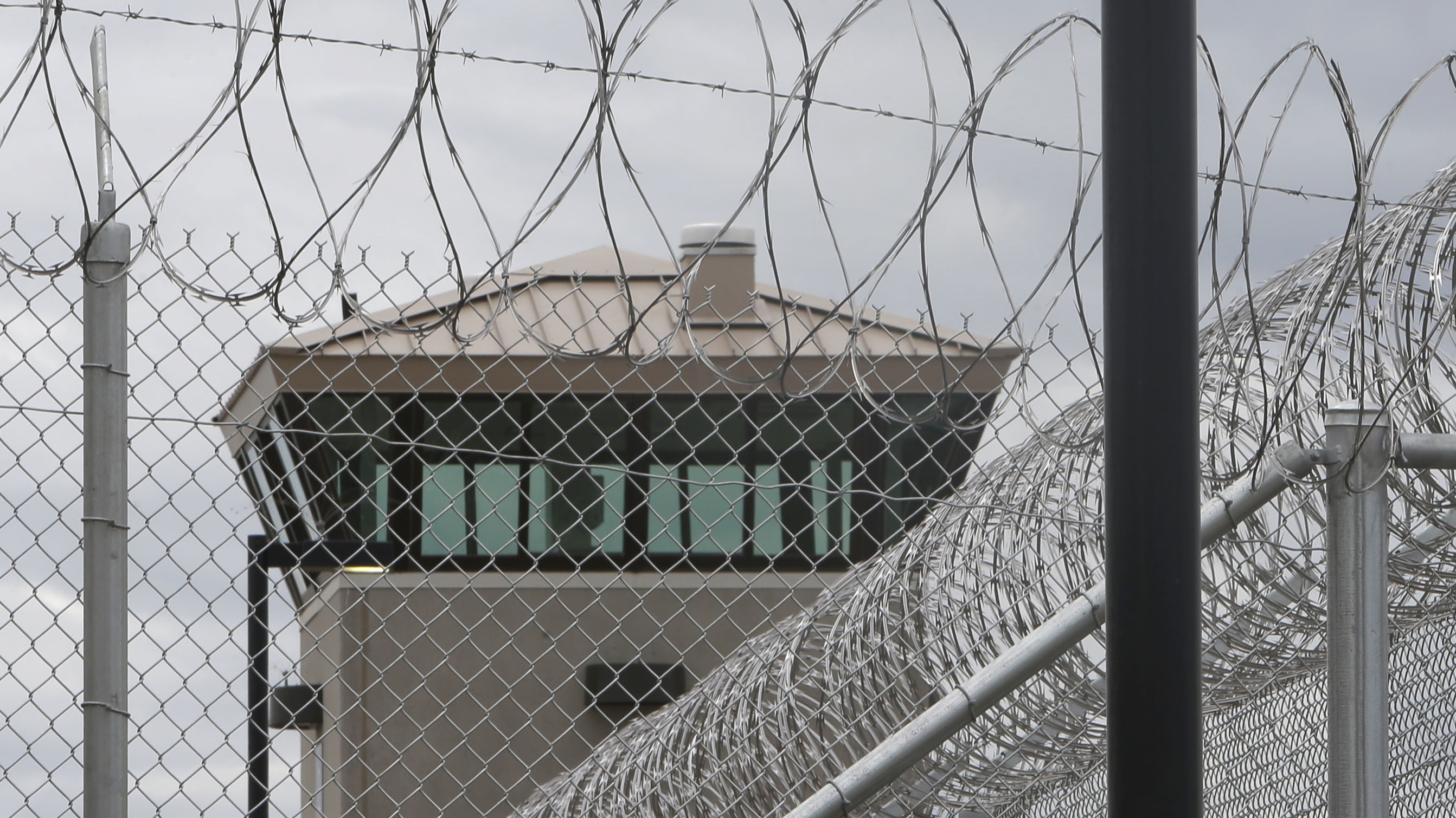  A guard tower looms over the fence surrounding a new California Correctional Health Care Facility in Stockton, Calif. The $839 million facility will treat up to 1,720 patients in need of long-term care. (Rich Pedroncelli/AP Photo, file) 