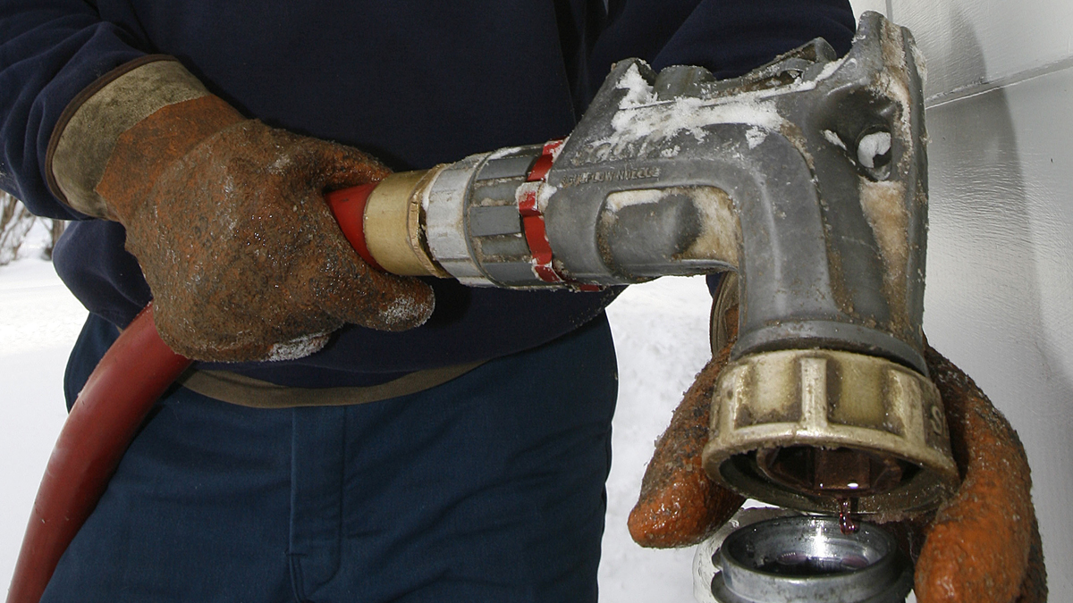  In this file photo, Wayne Holland of the Suburban Propane company delivers oil. (Toby Talbot/AP Photo, file) 