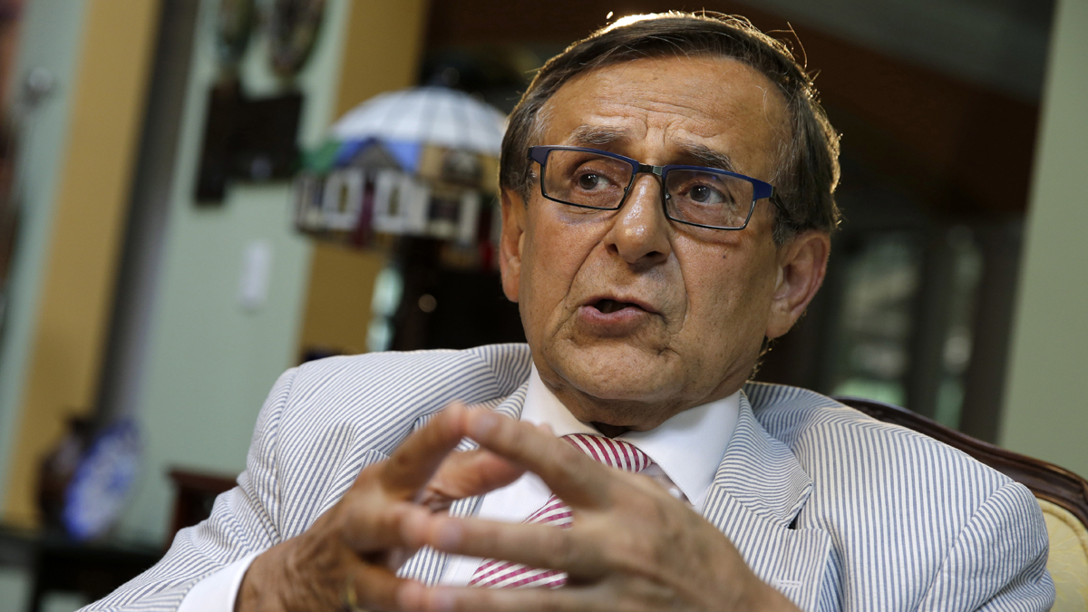Rutgers professor Hooshang Amirahmadi ponders a question as he sits at his home Wednesday in Princeton