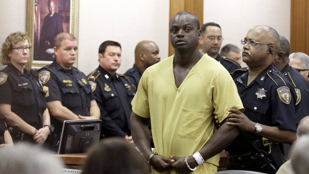  Shannon Miles is escorted out of a courtroom after a hearing, Monday, Aug. 31, 2015, in Houston. Miles has been charged with capital murder in the death of Harris County Sheriff's Deputy Darren Goforth. He is being held without bond. (Pat Sullivan/AP Photo) 
