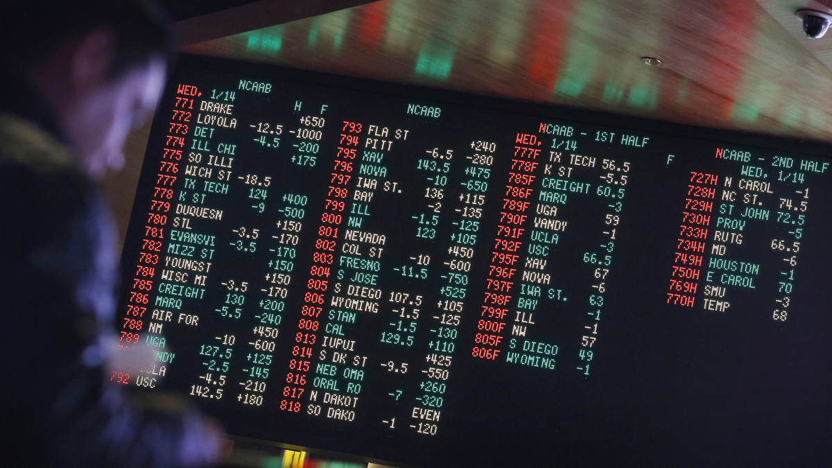 In this Jan. 14, 2015, file photo, odds are displayed on a screen at a sports book owned and operated by CG Technology in Las Vegas. (John Locher/AP Photo, File)