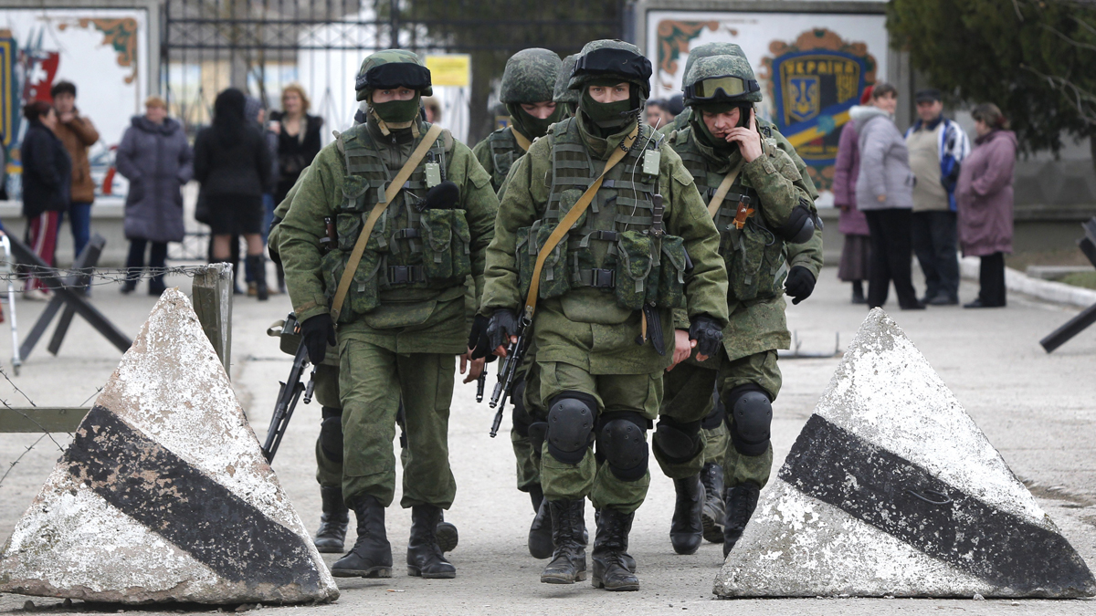  Pro Russian soldiers guard Ukraine's infantry base in Perevalne, Ukraine, Tuesday, March 4, 2014. Russian President Vladimir Putin said Moscow reserves the right to use all means to protect Russians in Ukraine as U.S. Secretary of State John Kerry was on his way to Kiev. Tensions remained high in the strategic Ukrainian peninsula of Crimea with troops loyal to Moscow firing warning shots to ward off protesting Ukrainian soldiers. (Sergei Grits/AP Photo) 