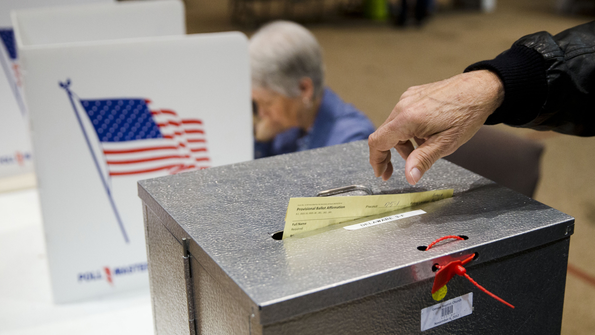 A voter casts a provisional ballot in the primary election Tuesday