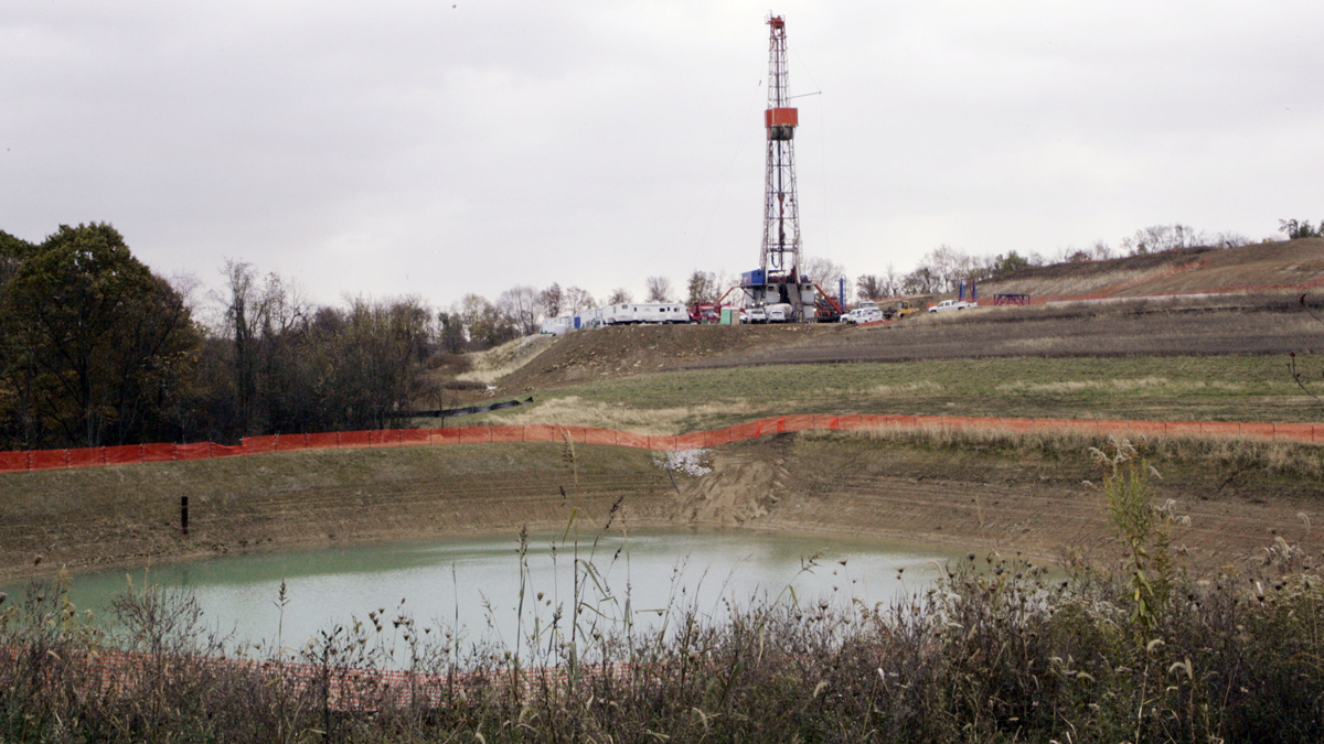 In this file photo, a drilling rig used to bore thousands of feet into the earth to extract natural gas from the Marcellus shale deep underground is seen on the hill above a reservoir in Houston, Pa. Wednesday, Oct. 29, 2008 (Keith Srakocic/AP Photo) 