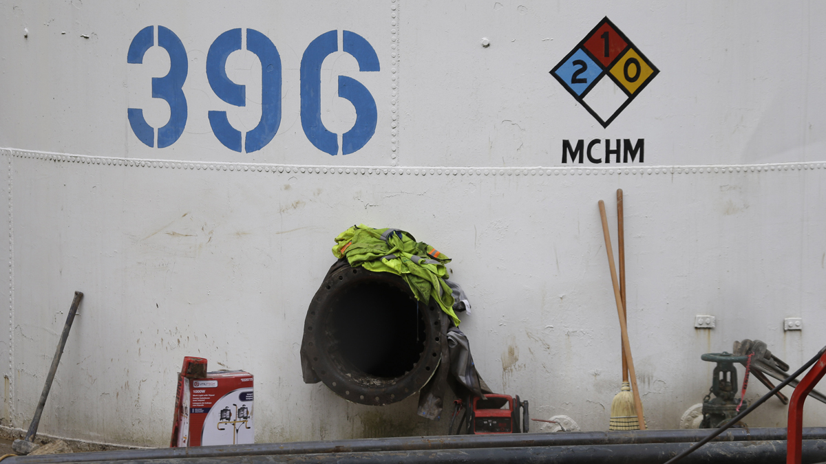  A storage tank with the chemical designation MCHM, 4-methylcyclohexane methanol, the chemical that leaked into the Elk River, is shown at Freedom Industries storage facility in Charleston, W.Va., Monday, Jan. 13, 2014. The ban on tap water for parts of West Virginia was lifted on Monday, ending a crisis for a fraction of the 300,000 people who were told not to drink, wash or cook with water after a chemical spill tainted the water supply. (Steve Helber/AP Photo) 