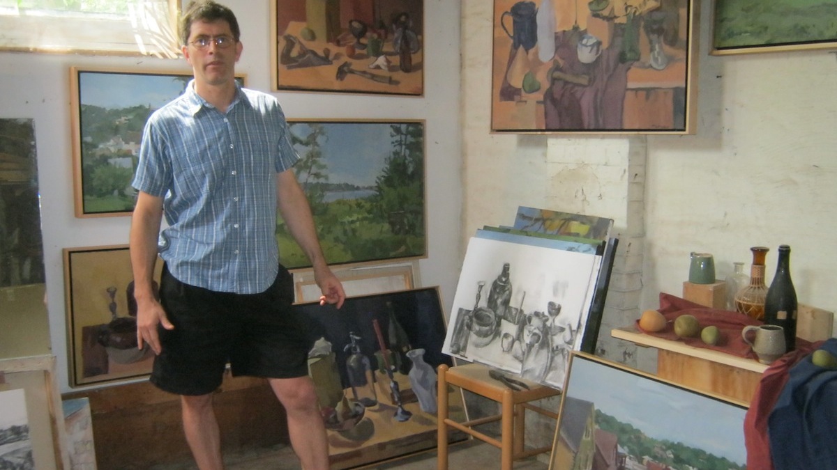  Artist Ian Tornay posing in his Queen Lane studio. (Alaina Mabaso/for NewsWorks) 
