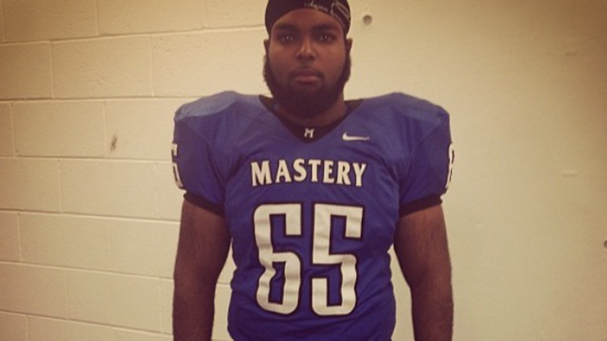 Austin Gibson is shown in his high school football uniform.