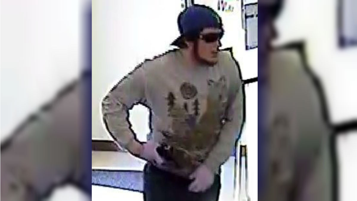  State Police are trying to identify the man seen in this bank surveillance photo. He's suspected in three bank robberies since May. (DSP photo) 