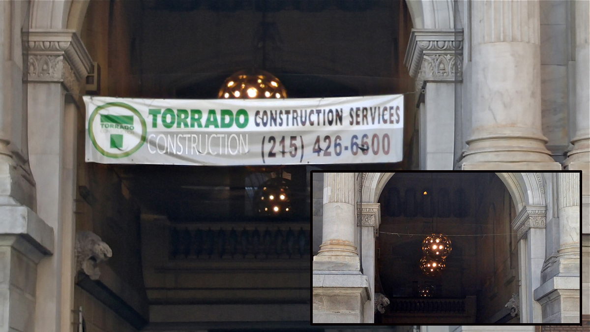  An advertising banner hung at City Hall has been removed and termed 