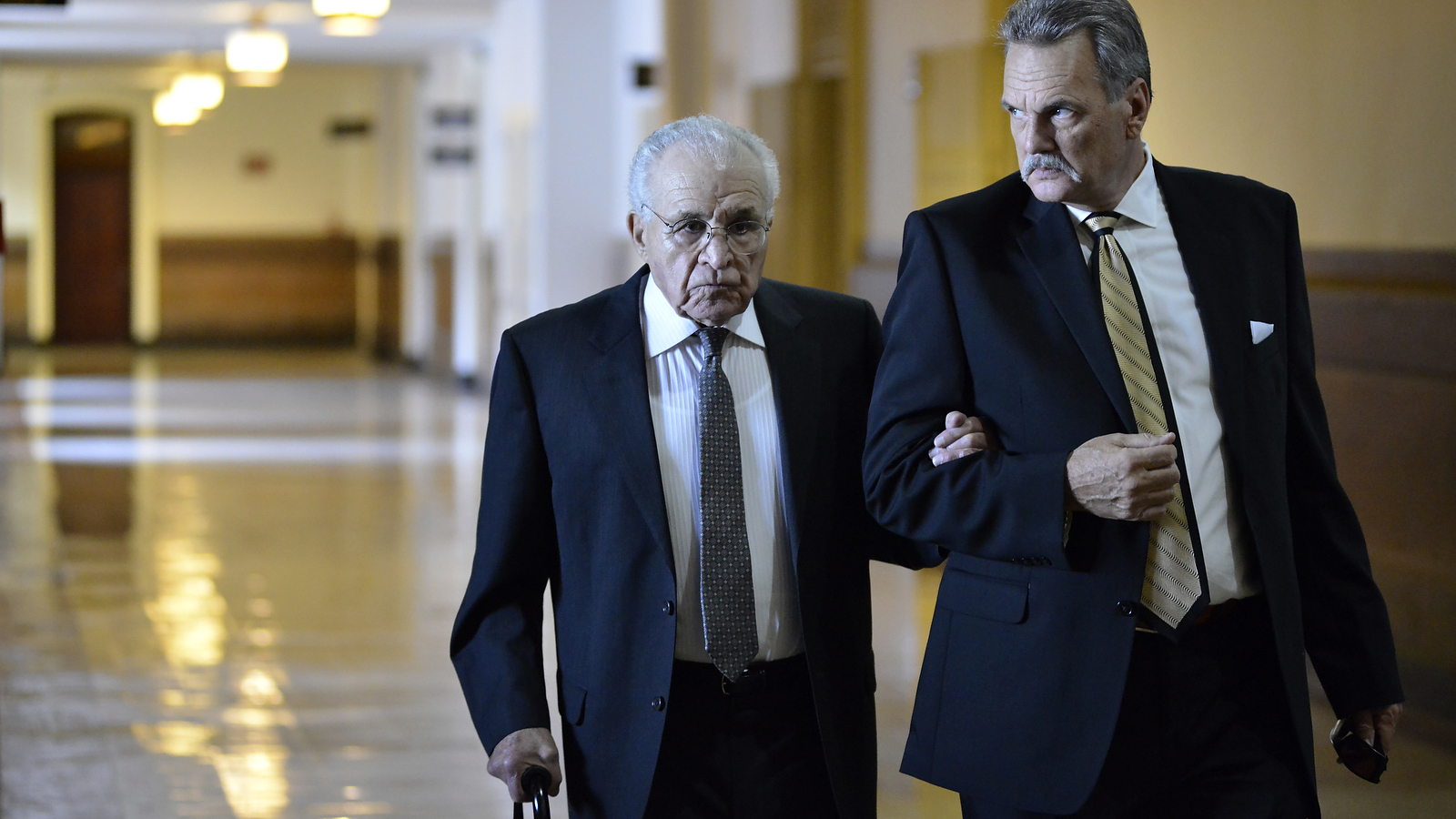 Richard Basciano (left)arrives at City Hall to testify in the civil trial that charges he has responsibility for the building collapse that killed six people in a Salvation Army thrift store in 2013. (Bastiaan Slabbers for NewsWorks)
