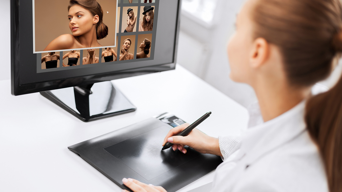 (<a href='http://www.bigstockphoto.com/image-61827653/stock-photo-photography%2C-office-and-magazine-concept-female-retoucher-with-drawing-tablet-and-computer-working-at-home-or-office'>Big Stock</a>)