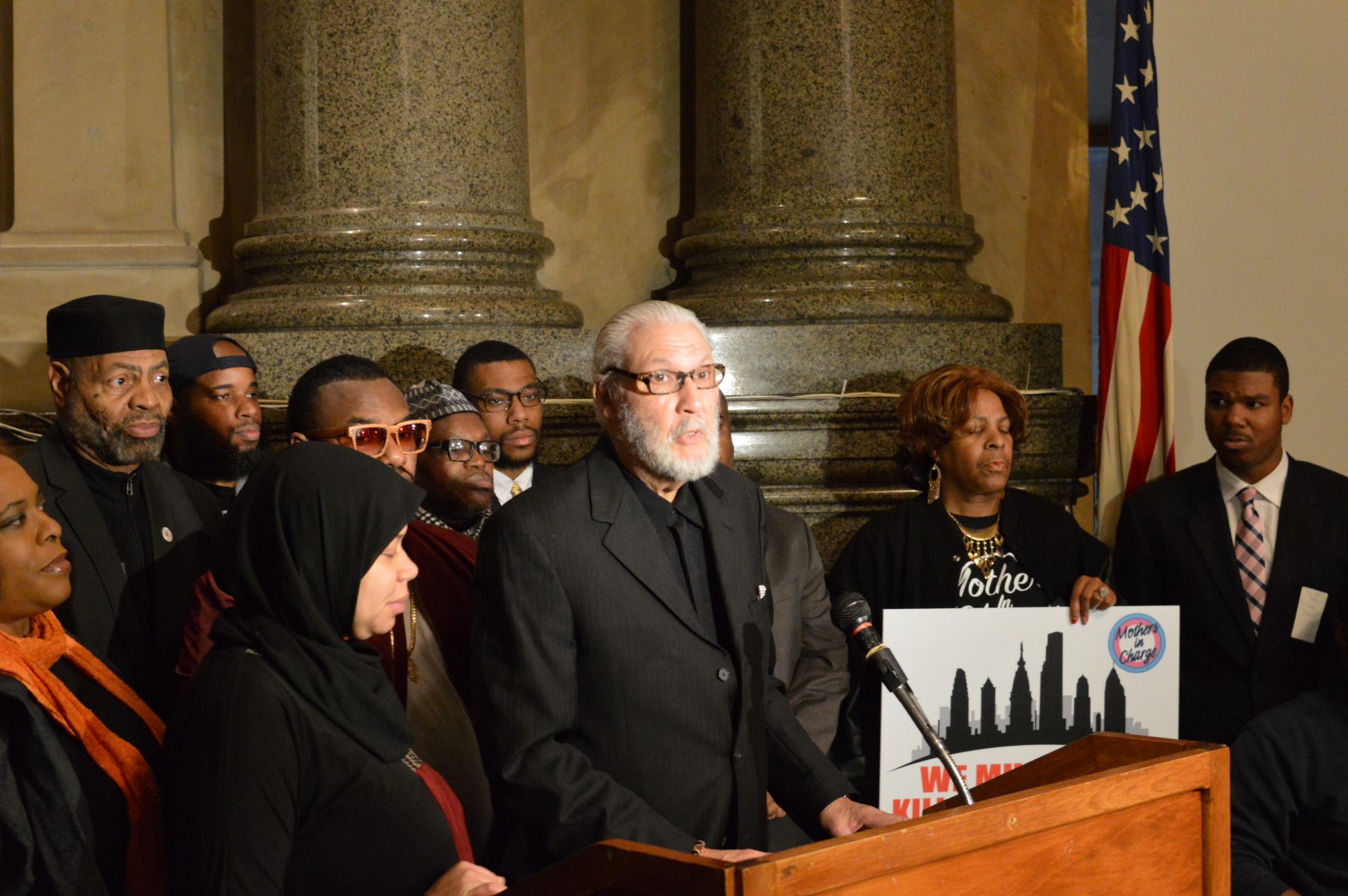 Peace activists speak out at City Hall Wednesday about a plan to establish February as 