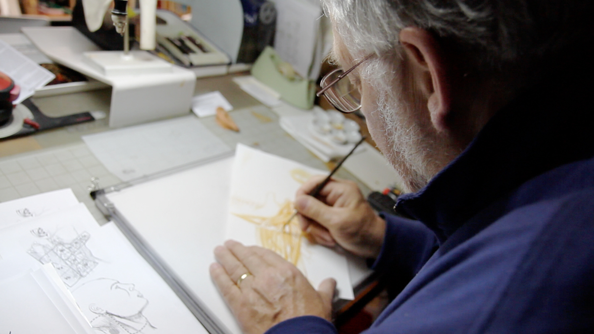 Medical Illustrator Birck Cox at work in his basement studio in Mt. Airy. (Todd Vachon/WHYY)