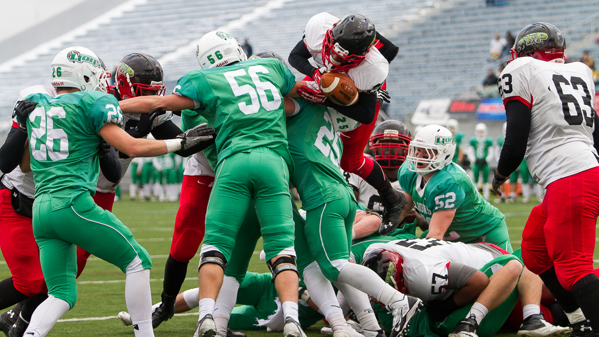  Nasir Bonner of Imhotep tries to jump over the line for a touchdown, but was stopped. The drive ended with a turnover on downs. (Brad Larrison/for NewsWorks) 