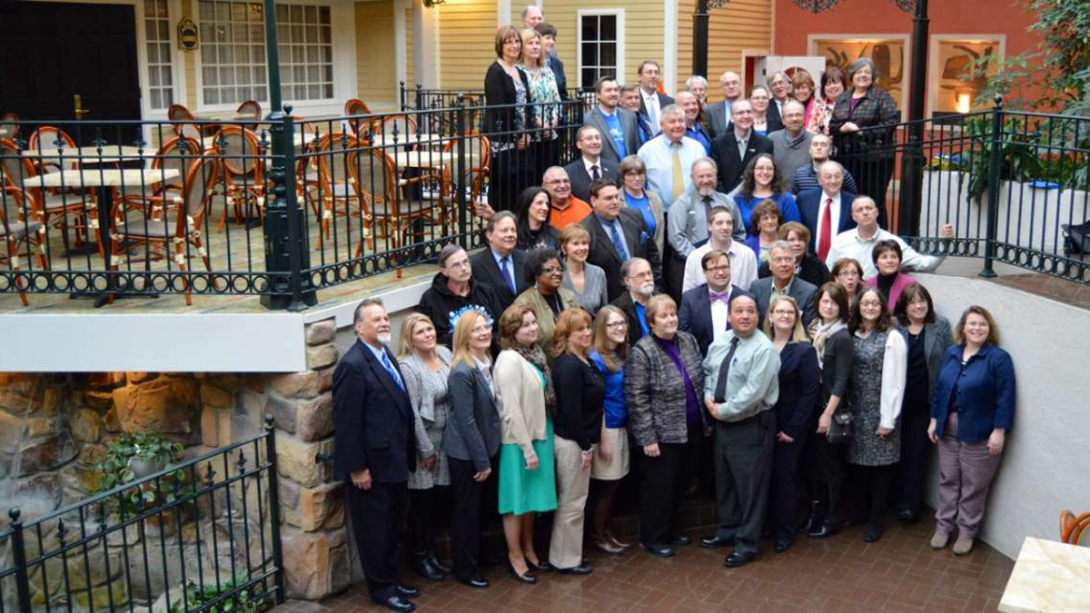  The graduates of Blueprint Communities 2015 pose for a group shot at a State College hotel lobby. (Kate Lao Shaffner/WPSU) 