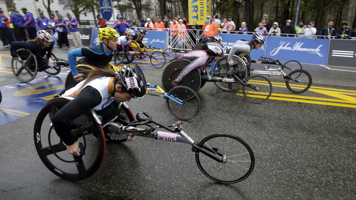  Competitors leave the start line in the women's wheelchair division of the Boston Marathon in Hopkinton, Mass. (AP Photo/Stephan Savoia) 