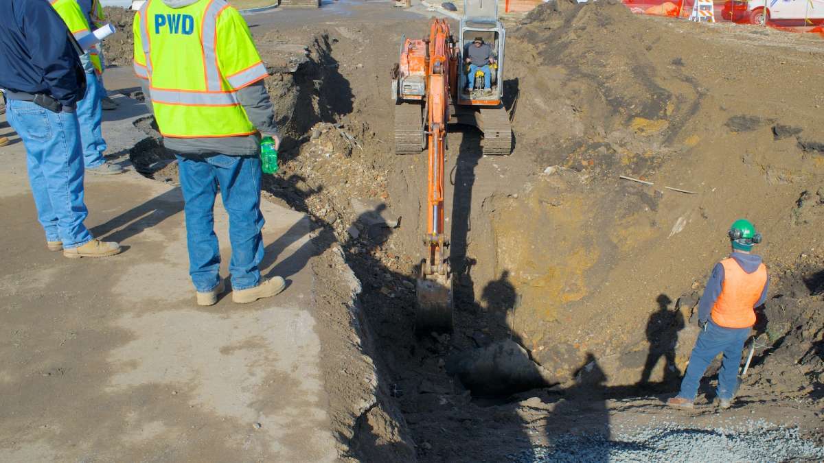  Philadelphia Water Department workers at Bakers Centre in East Falls on Monday morning. (Bas Slabbers/for NewsWorks) 