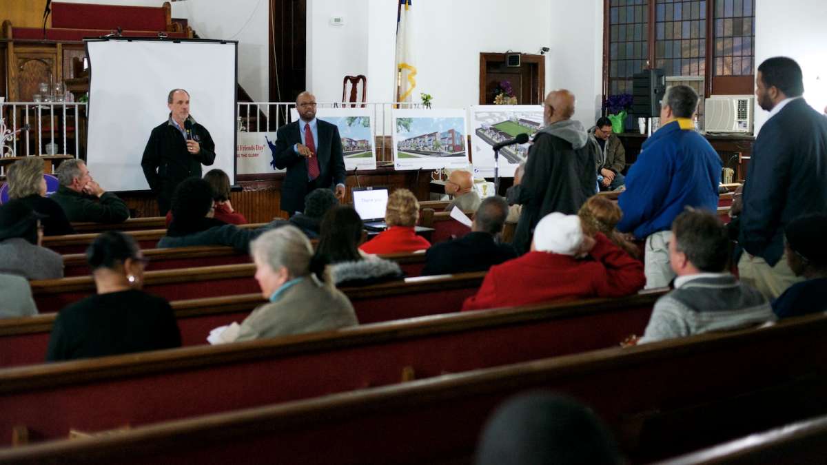  PHA representatives, developers and demolition-company officials met with neighbors ahead of the planned demolition of the Queen Lane Apartments high-rise tentatively scheduled for October. (Bas Slabbers/for NewsWorks) 