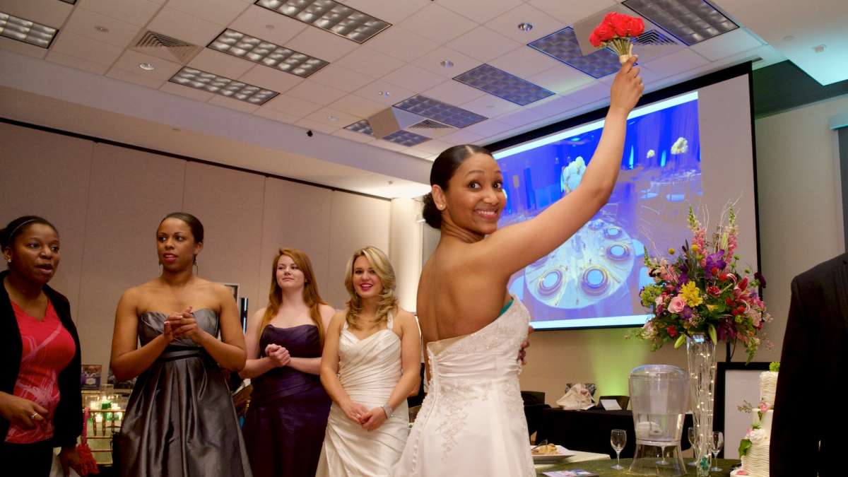  A bouquet is tossed into the crowd of future brides at Sunday's bridal-fashion show in Mt. Airy. (Bas Slabbers/for NewsWorks) 