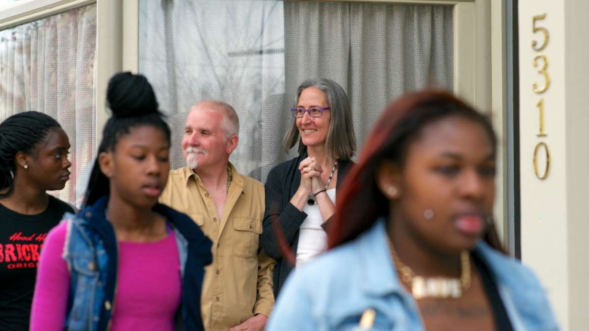  Stephen Ostapowicz and Tracy McNeil stand in front of Sandalwood Yoga. (Bas Slabbers/for NewsWorks) 