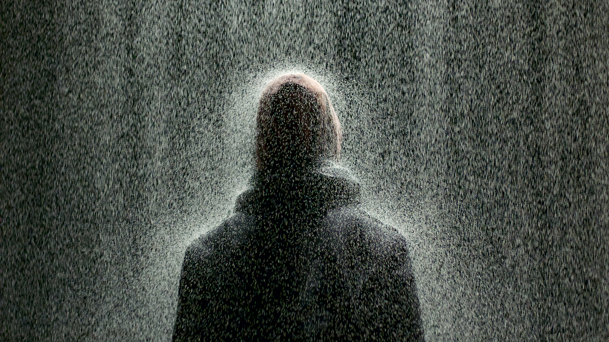 A shower of sand comes down as part of the Article 13 exhibition/performance art piece in PIFA