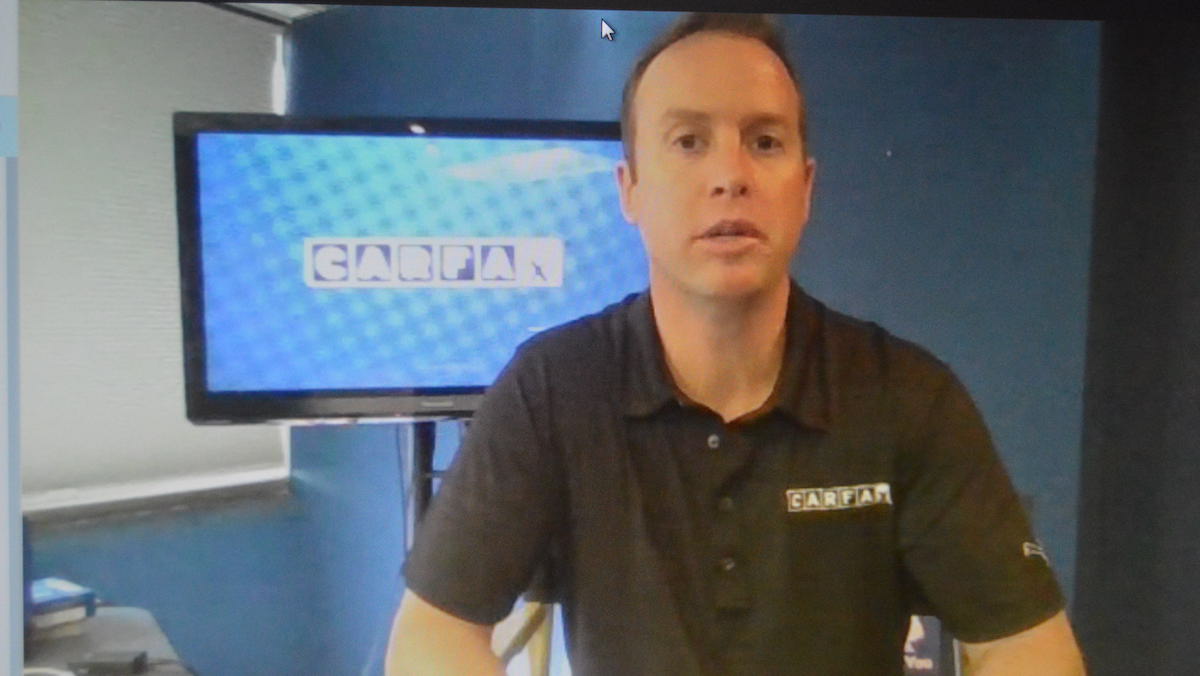 Chris Basso of the website Carfax says to beware of cars that may have been damaged by flooding. (Tom MacDonald/WHYY)