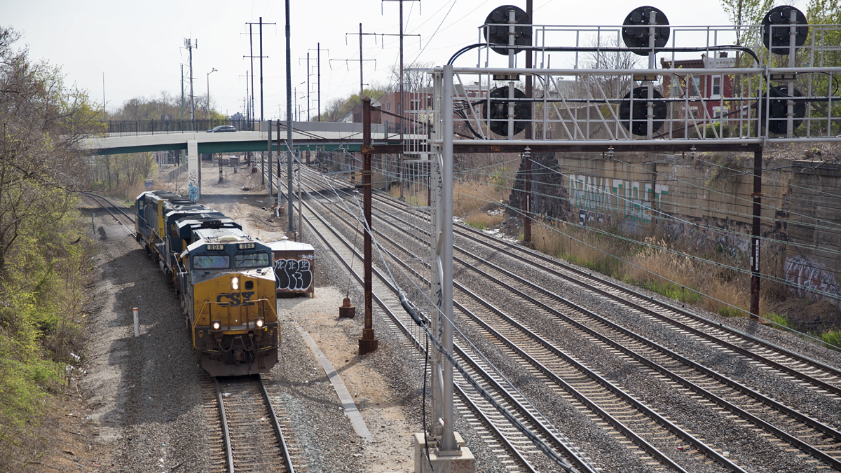  A cargo train passes through the northeast rail corridor in Philadelphia, Pa.  (Lindsay Lazarski/WHYY) 