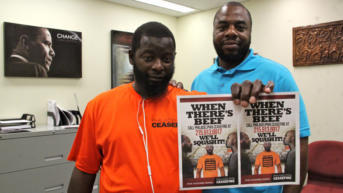  CeaseFire supervisor Quinzel Tomoney (left) and project manager Robert Warner are fighting gun violence in North Philadelphia. (Emma Lee/WHYY) 