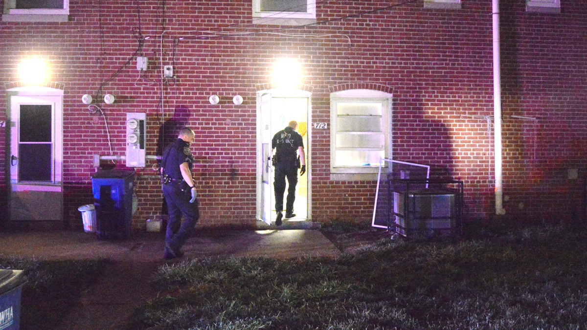  Police search for clues after a 10-year-old was shot early Tuesday morning. (John Jankowski/for NewsWorks) 