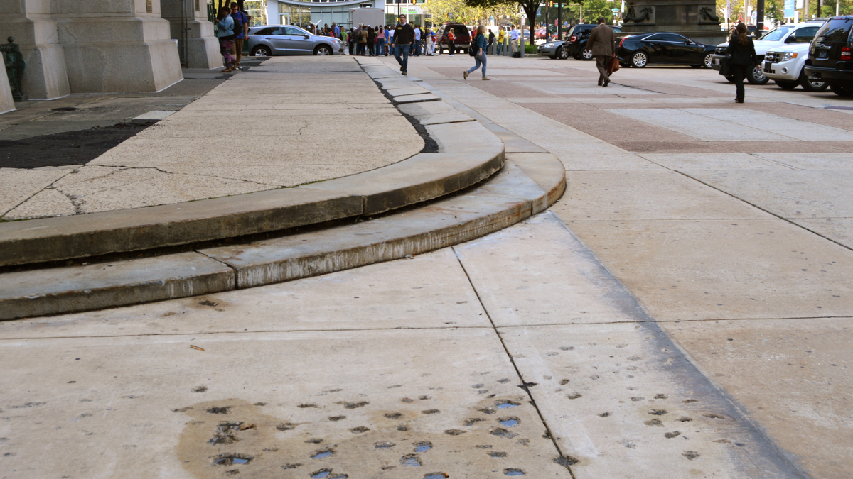 After two years of construction, the concrete around City Hall, known as the apron, has taken a pounding. (Tom MacDonald/WHYY) 