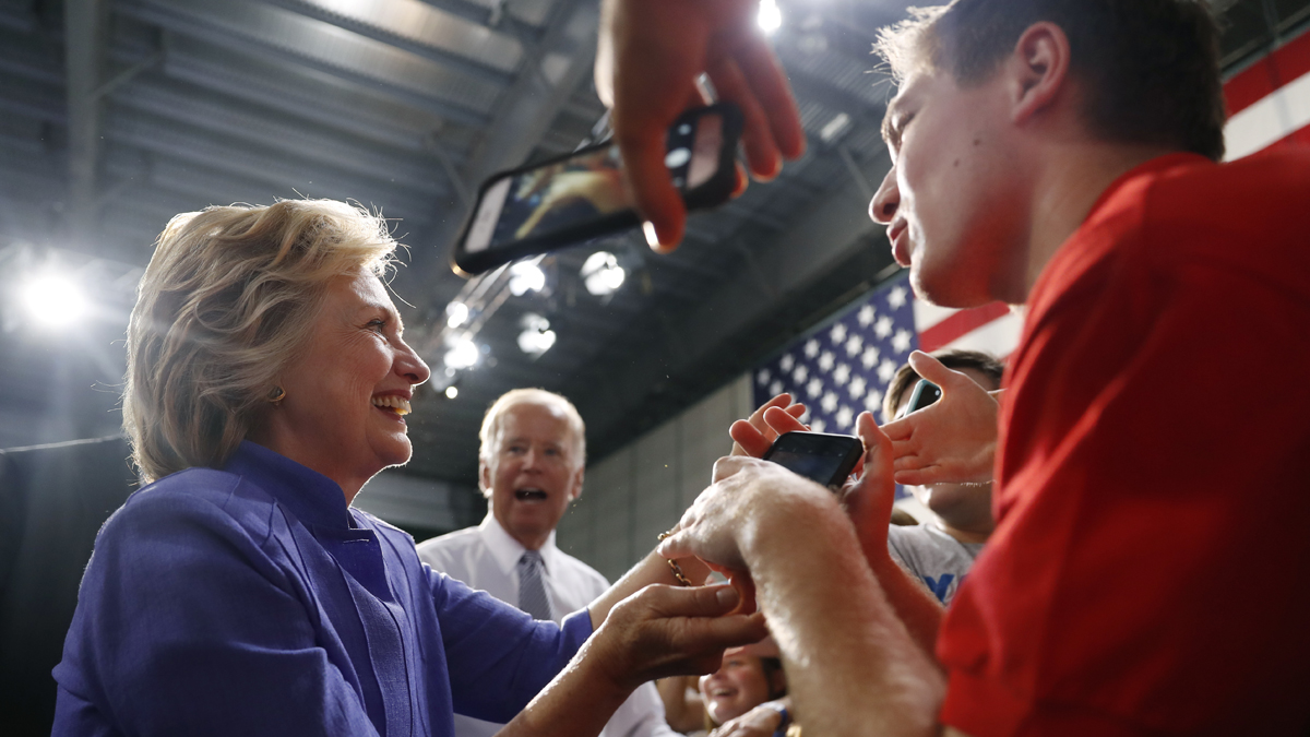 Democratic presidential candidate Hillary Clinton and Vice President Joe Biden greet people in the audience after speaking at a campaign event at Riverfront Sports in Scranton