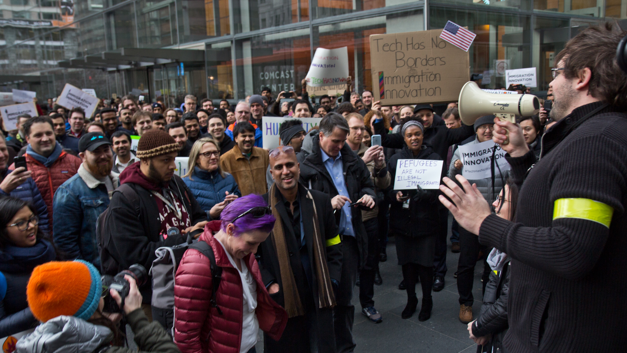 Comcast employees left their jobs at 2 p.m. Thursday to protest President Trump's executive order on immigration. (Kimberly Paynter/WHYY)