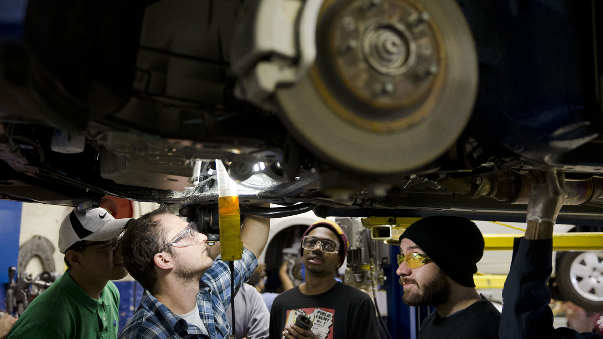  Automotive service technology students work on a car at the Community College of Philadelphia, in Philadelphia, Pa. (AP File Photo/Matt Rourke) 