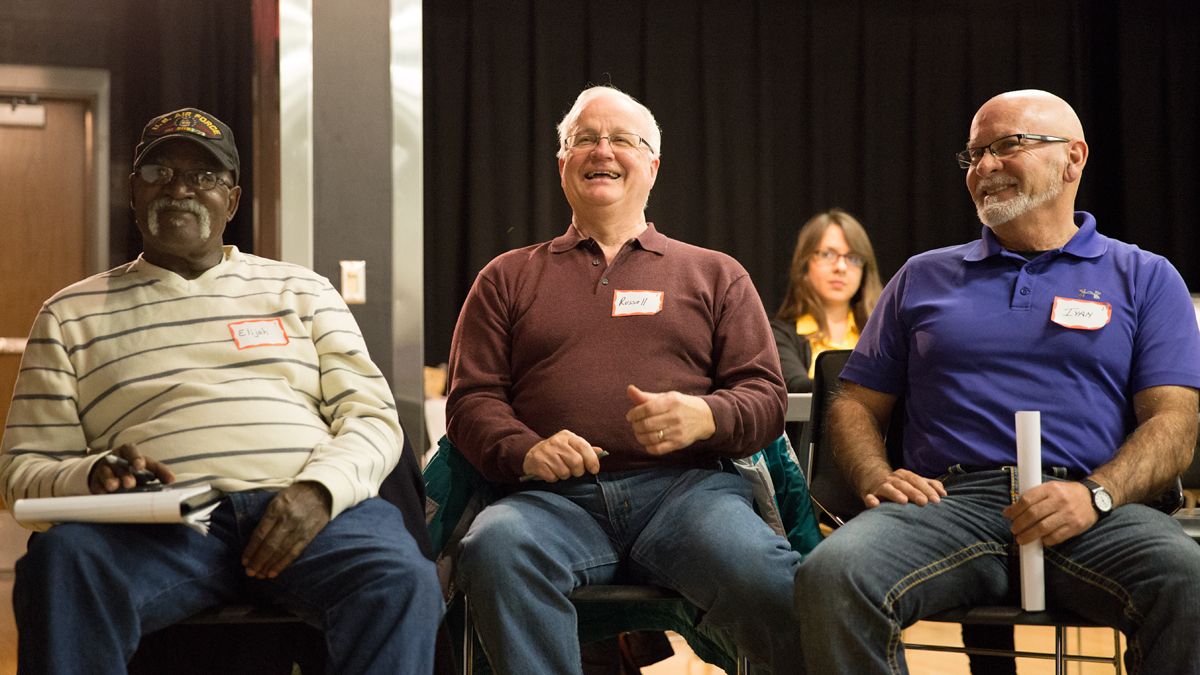  From right to left: Elijah Rhodes, Russell Anderson, and Ivan Torres respond to a question about who in the Reading community is doing great work and should receive money to support their work.  (Lindsay Lazarski/WHYY)  