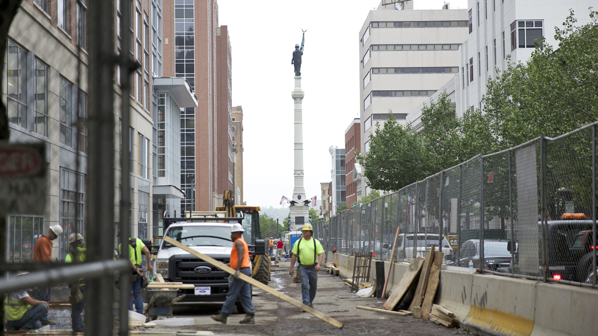 Construction workers build the new PPL Center on Hamilton Street in downtown Allentown.  The city’s new hockey arena opened in September 2014.  (Lindsay Lazarski/WHYY)