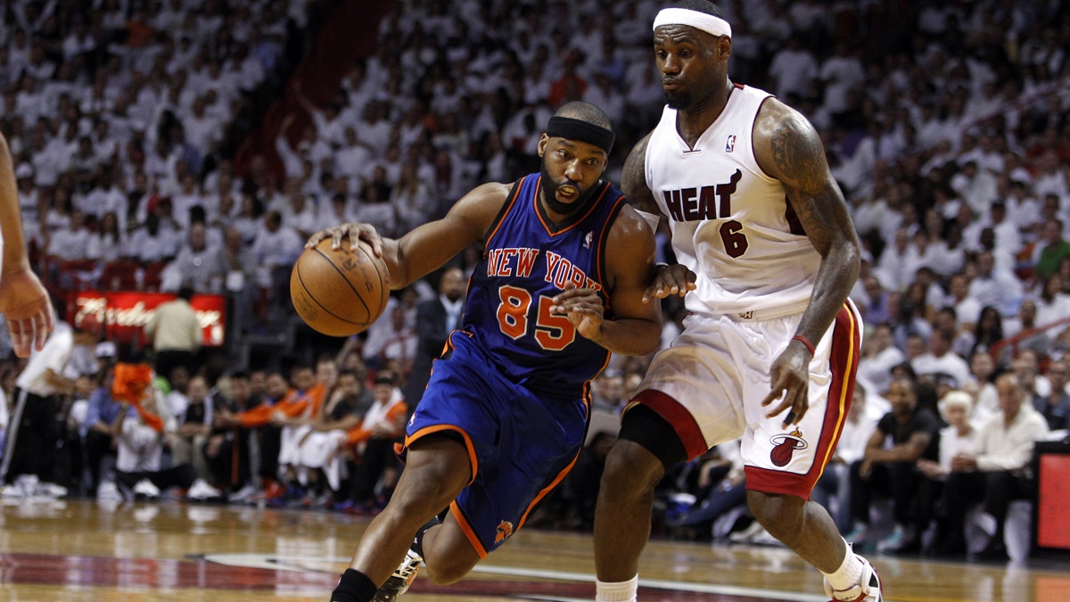 New York Knicks' Baron Davis (85) drives to the basket past LeBron James (6) in the second half during an NBA basketball game in the first round of the Eastern Conference playoffs in Miami