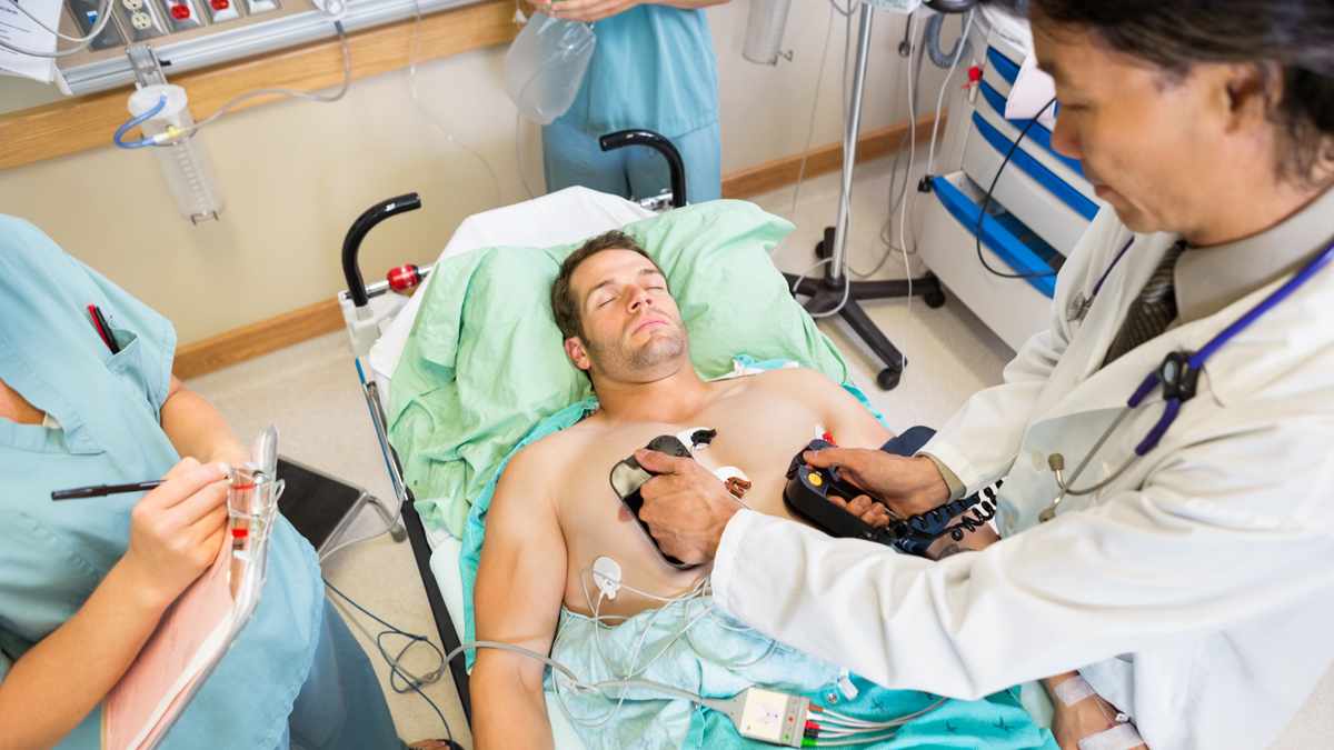 Doctors attempt to restart a patient's heart. Unfortunately