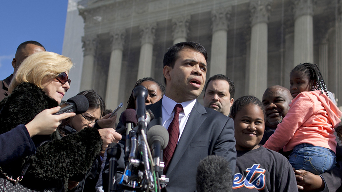  Debo Adegbile (center), special counsel, NAACP Legal Defense Fund, speaks with reporters outside the Supreme Court in Washington. (AP file photo/Evan Vucci) 