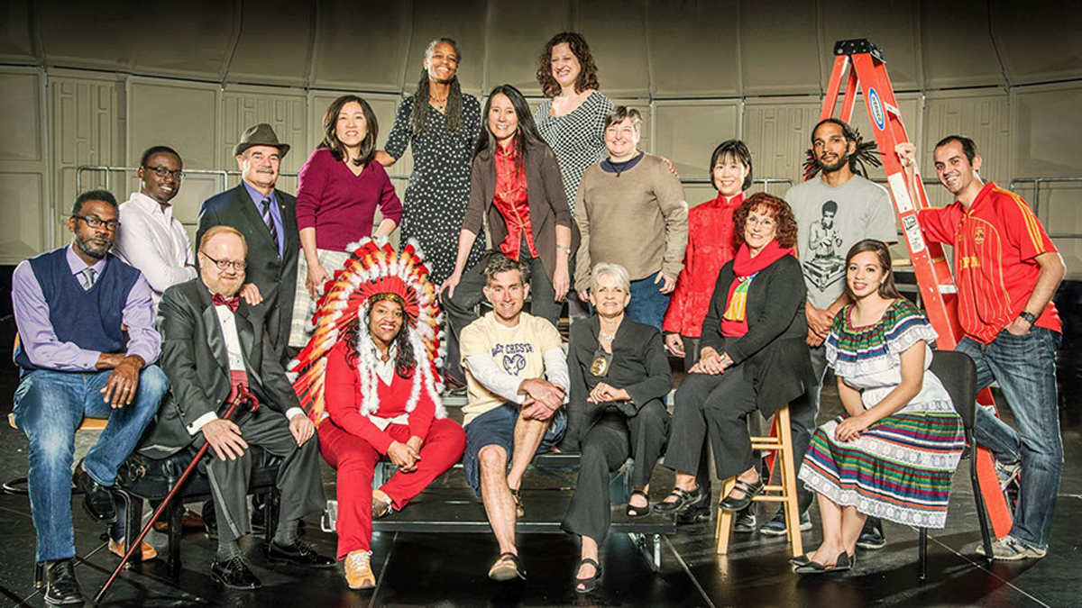  West Chester University professor Anita Foeman (top left) created the project, and student Daniel Schwartzman (standing second from left) is waiting for his DNA results. (Photo by Bob Laramie) 