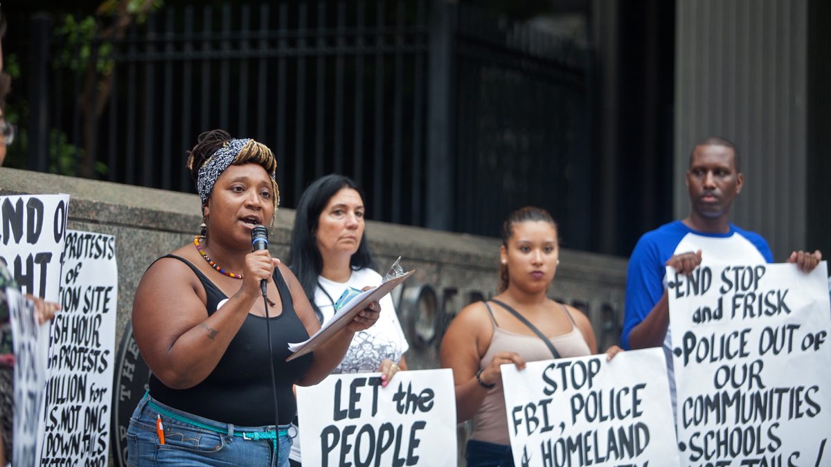 Erica Mines with the Philadelphia Coalition for REAL Justice organized a rally Tuesday calling on the city to lift its protest restrictions during the Democratic National Convention in July. (Brad Larrison for NewsWorks)