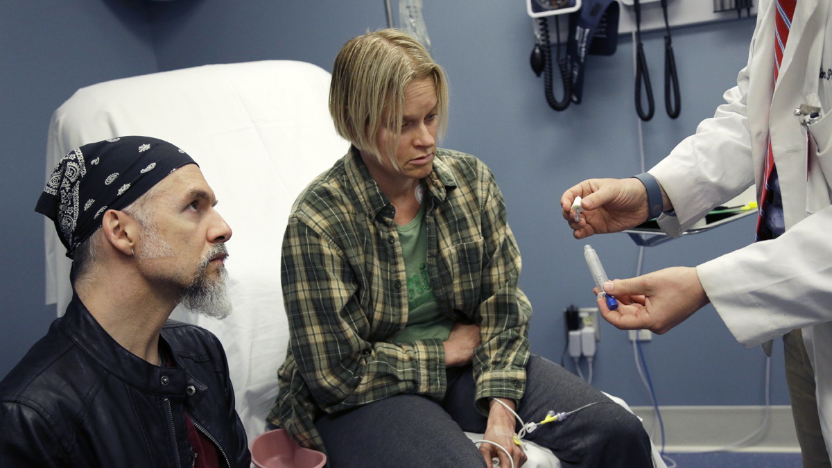 A medical student demonstrates a nasal Naloxone for emergency treatment of opioid overdose to actor-patients during a simulation at a medical school in Worcester