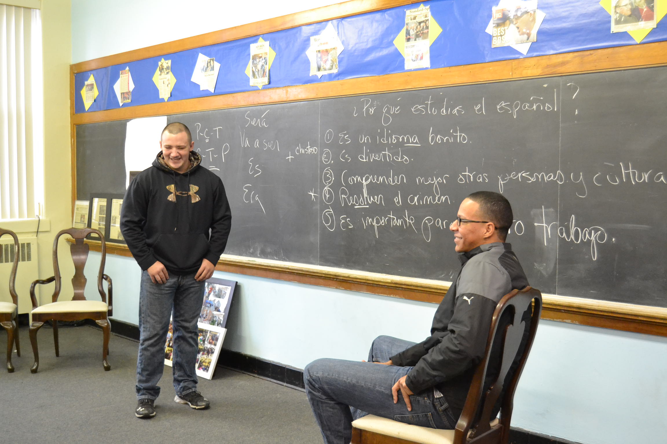  Two of the Hazleton Police Department's newest hires practice interacting in Spanish. Officer Pedro Bautista (right) is bilingual but attends class to help his fellow officers learn.  (Eleanor Klibanoff/WPSU) 