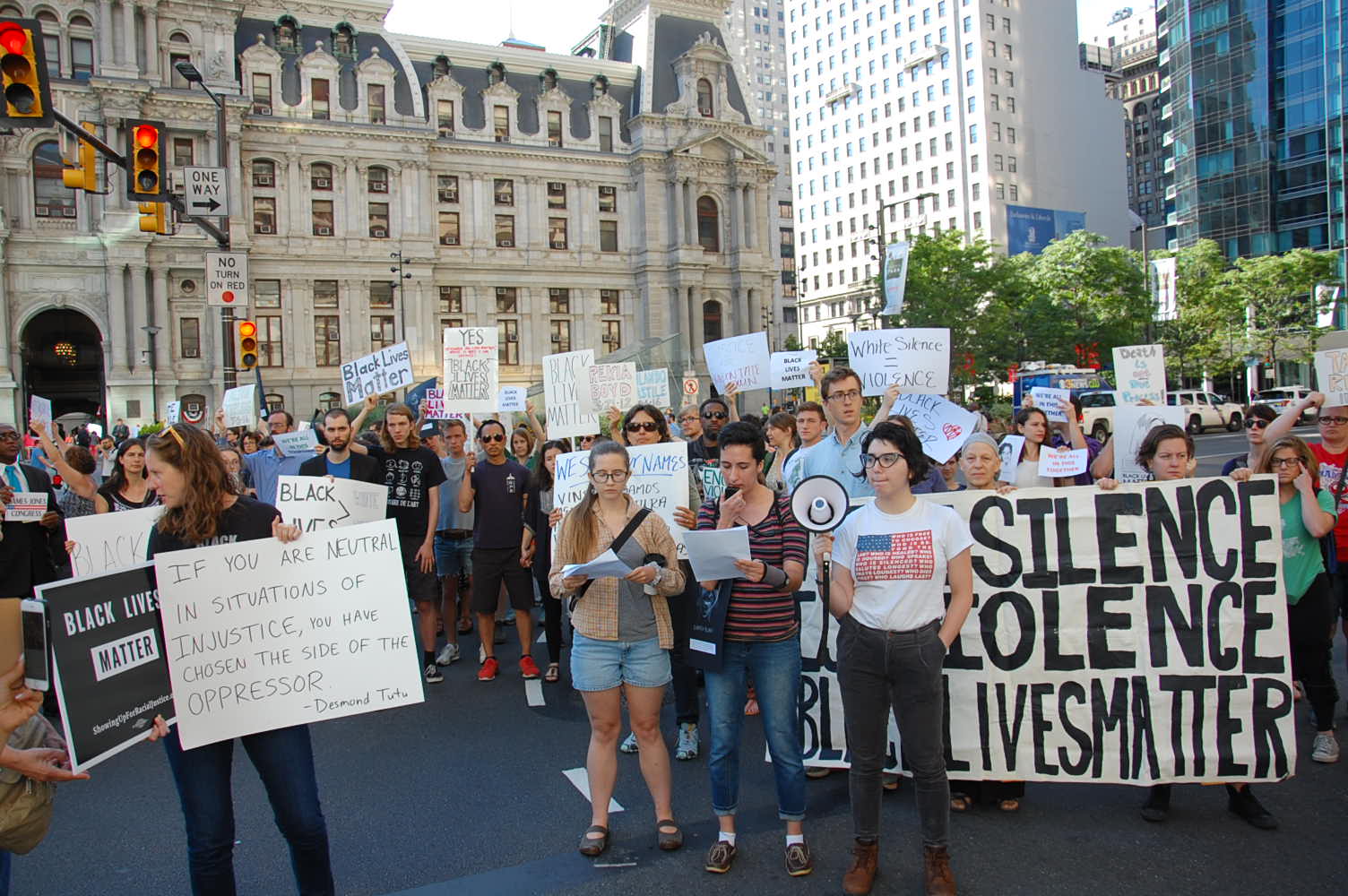 Protestors block streets outside City Hall (Tom MacDonald / WHYY)