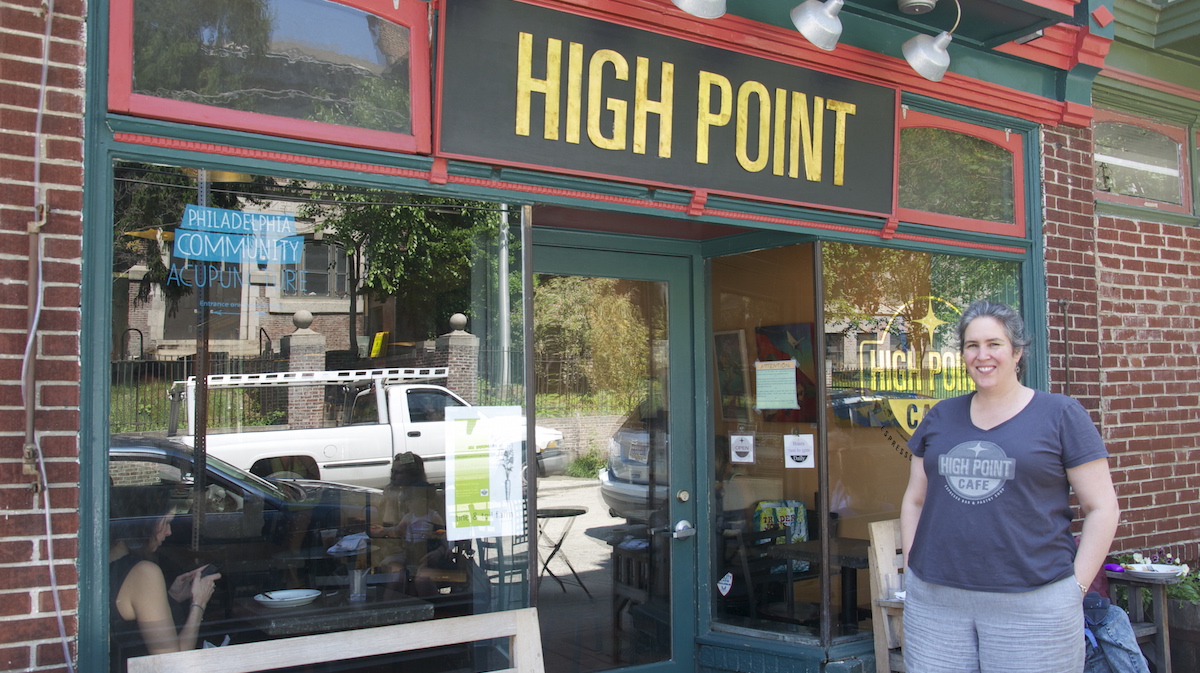  Meg Hagele stands in front of High Point Cafe on Carpenter Lane. (Greta Iverson/for NewsWorks) 