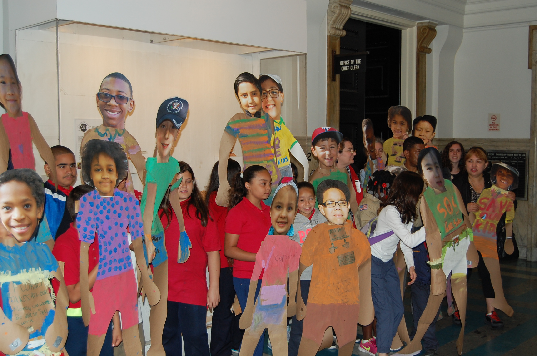  Students protest outside Council Chambers with kid-sized cut outs to demonstrate overcrowded class sizes. (Tom MacDonald/WHYY) 
