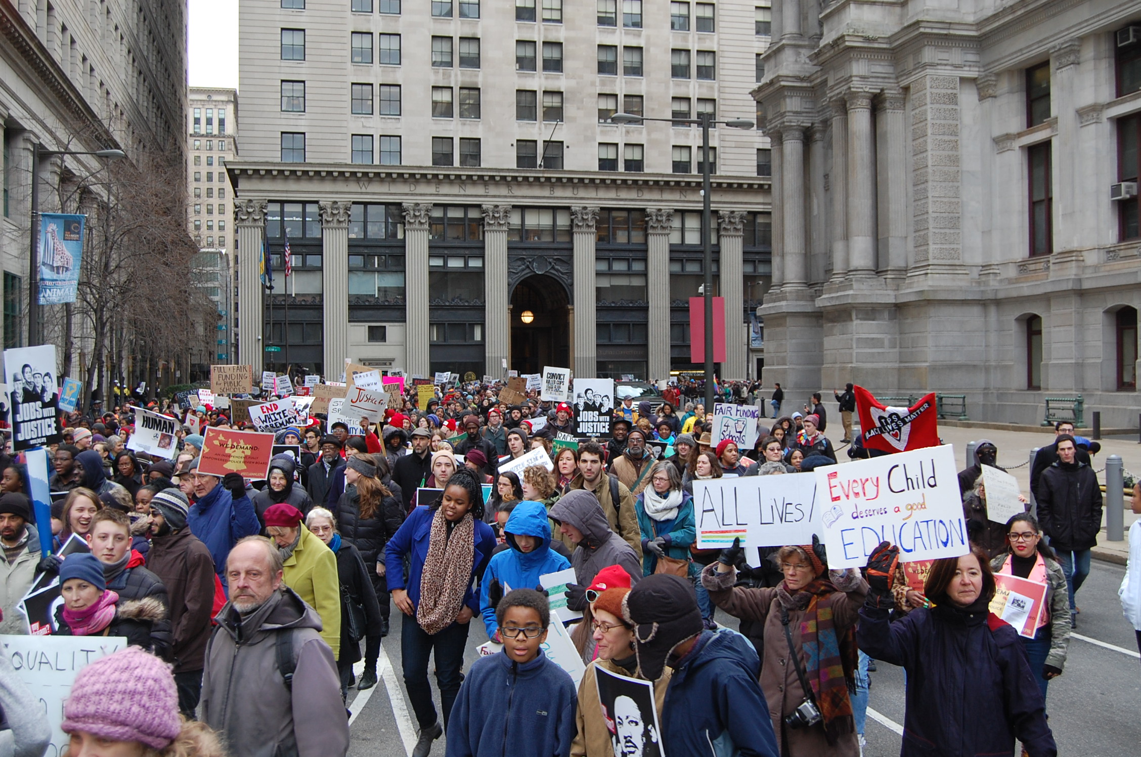  Protesters rounding Philadelphia City Hall before heading up Market Street (Tom MacDonald/WHYY) 
